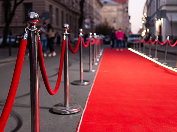red carpet lined up outside a large building
